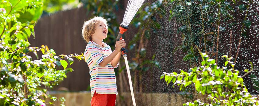  ABP-kid playing with the hose 