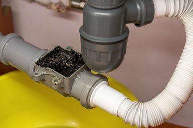 a drain valve clogged with debris